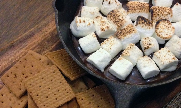 Marshmallows in frying pan and graham crackers for smores